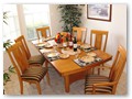 Here you will find a large dining table and chairs for 6 Persons...