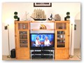 A closer look on the entertainment center with the 50'' plasma HD TV with the DVD dolby sorround sound system with iPod / iPhone interface.