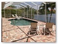 A highlight is the spacious, south facing pool deck with a beautiful view of the wide De Leon canal.