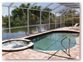 The pool is a kidney shape pool and has solar and electric heat pump heating.